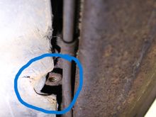 From underneath the car. This is the same threaded weld nut. That is all you can see of the frame extension. I have to open up my fiberglass sill panels to replace them both. Fun!