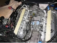 The starter goes at the rear down in the V of the block,with everything bolted on top of it. It 