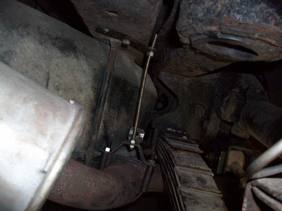 I then turned my thoughts to the exhaust system. The driver’s side pipe had once again sagged down as a few had noted - thanks. Taking lessons lessons from Jim, I added BUBBA hangers at the elbow behind the rear spring. I didn’t want to drill or modify the frame or anything, so used HOARDED JUNK I had laying around to attach the hanger to the frame. I pulled the pipes to within 1/2” of the spring. If this works, I will probably buy the aftermarket hangers to make it look more PRO.