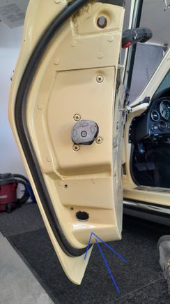 If it's a slot does it go side to side? 
Does anyone have a picture  of a undamaged door?
What does the stock hardware look like, just a bolt and washer?