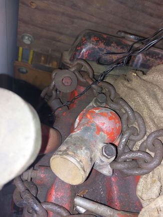 Known original 68 327. Less than 1/2" clearance for the radiator hose on the thermostat housing.