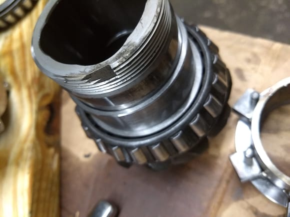 Looking at this area where the threads are supposed to be staked, seems like they've given plenty of room to do so but doesn't seem like anyone did that to the pinion nut. 