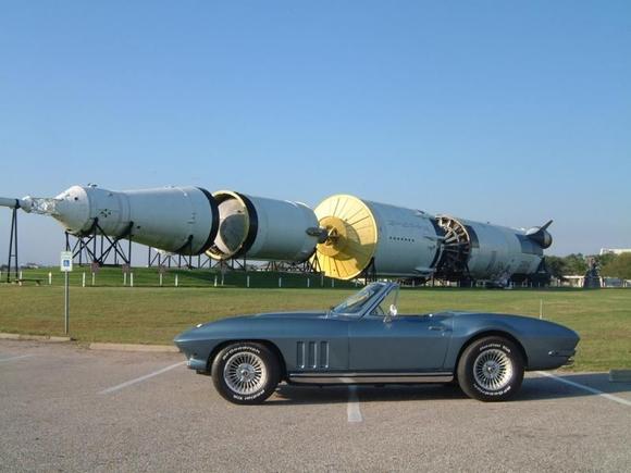 NASA Houston -  Security allowed me to park here for this shot, but I left it anyhow to check out the Saturn 5 Rocket in the background. Shortly afterwards a tour bus let out a large group of European tourists.  Where did they all go to stand for pictures?  Yup- The vette.