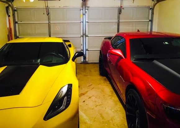 This is my vette and my Hubby's Camaro side by side in the garage.