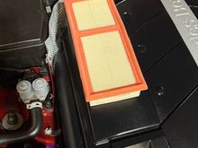 OEM filter on top of the larger air filter chamber.  The difference is dramatic.  I had already installed the new filter and didn't want to take it out for comparison, but you get the idea.