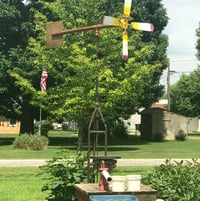 Using an old ceiling fan and spare parts from around the yard and shop we made a functioning decorative windmill. We replaced the cardboard fans with cut pieces of plexiglas for 2021.
