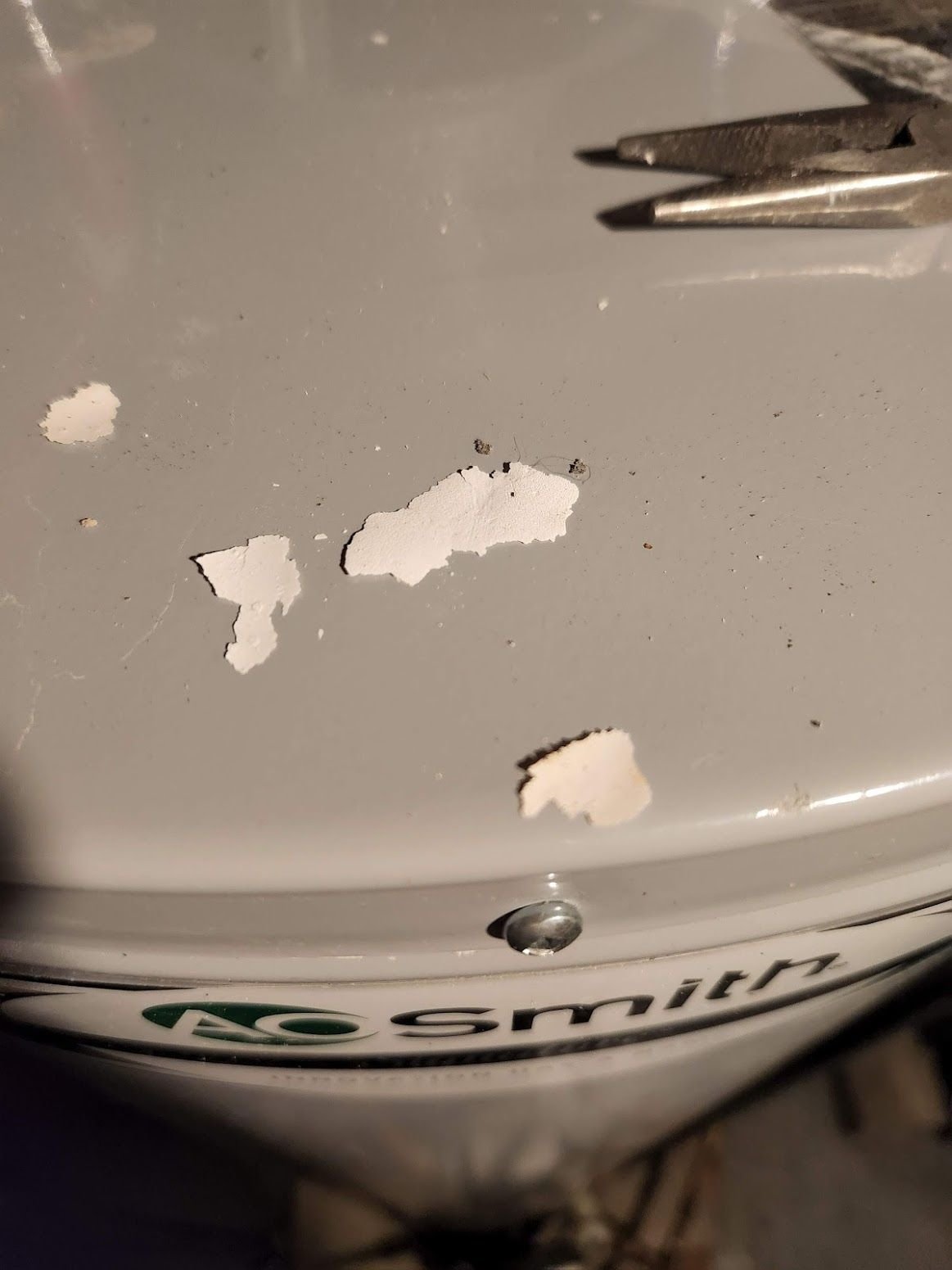 Water heater plastic cement smell and white flakes near exhaust/vent