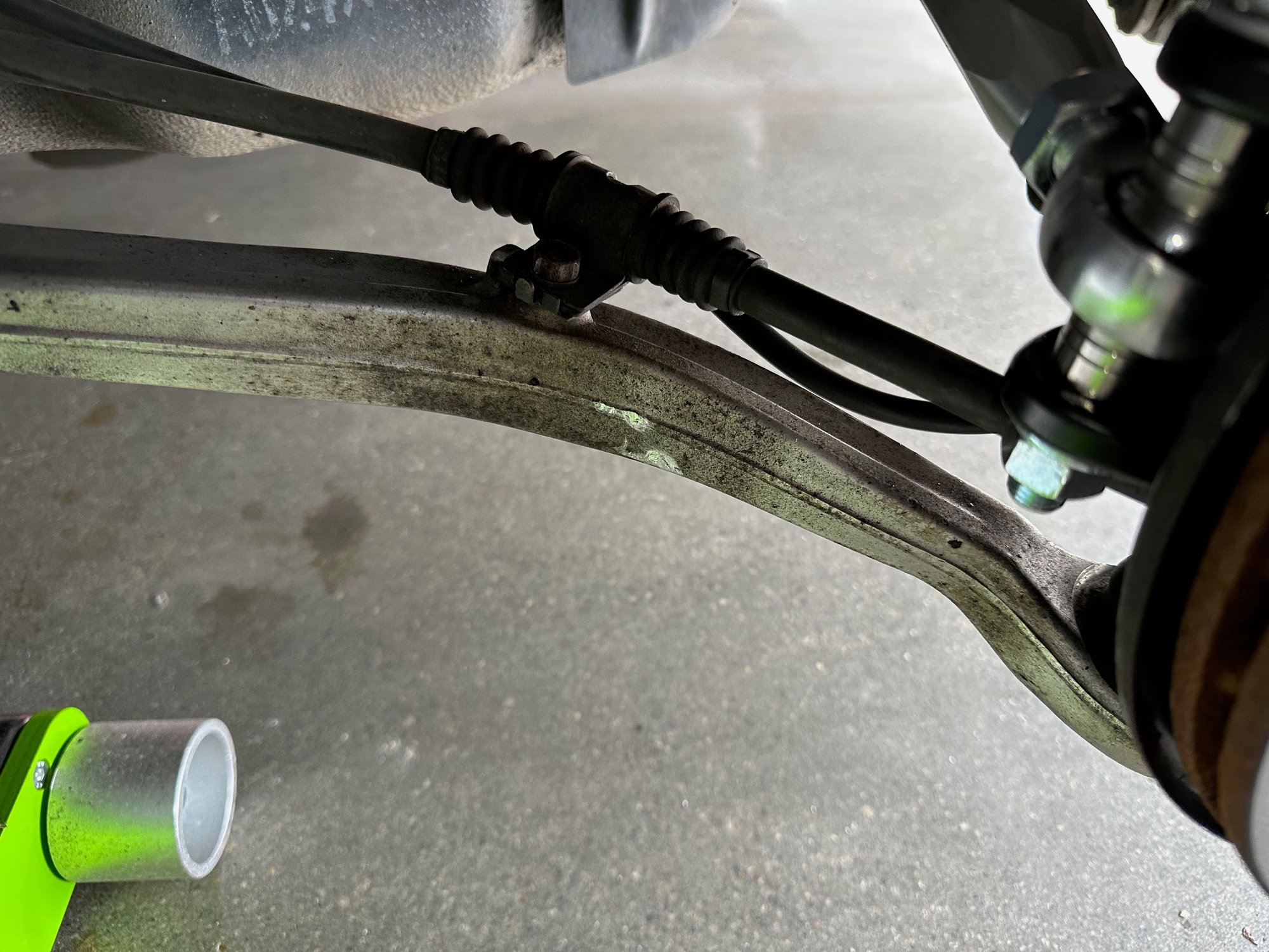 Where the wheel contacts the arm