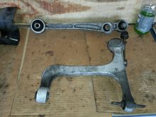Upper and lower control arms off, and dirty. The upper one was a pain due to the proximity to the fuel neck to the filler.