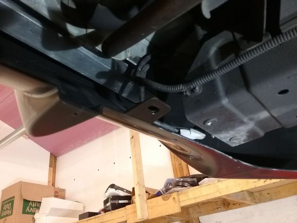 I need to build some sort of support bracket to take advantage of the factory push-pin location that holds the bottom up?  See the plastic hole?