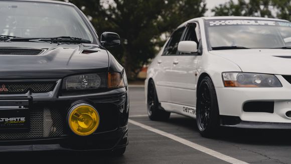 This is how my 18x9.5 +40 nt03's fit on my evo 9 with a 25mm spacer up front. The caliper clearance on mine is diff than most because I run a big brake kit on mine. On factory brembos the smallest spacer you can get away with is a 22.5mm spacer IIRC. 
