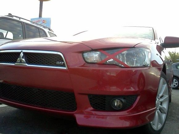 blink eye, japan style! 
before the cops ask me to remove it :(
-your headlight is broken?
-no
-Why you have tape on it?
-Blink eye
-.... remove it!