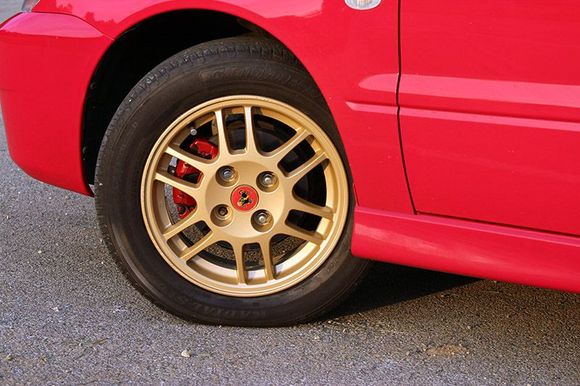 Painted the calipers and rims and added a vintage Mitsubishi Lancer center cap.