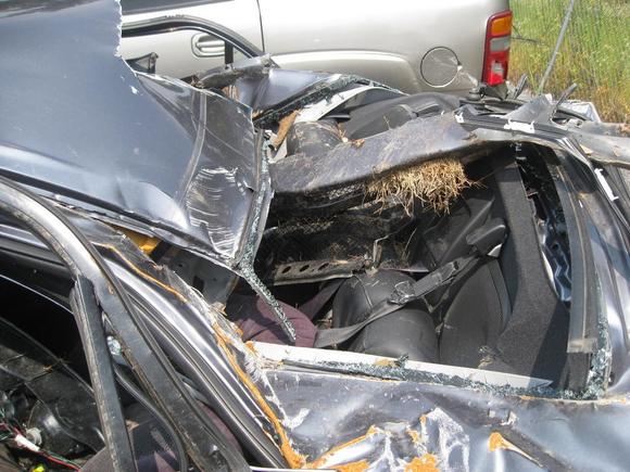 totally crushed rear, aluminum roof sheared from the rear frame because of impact!