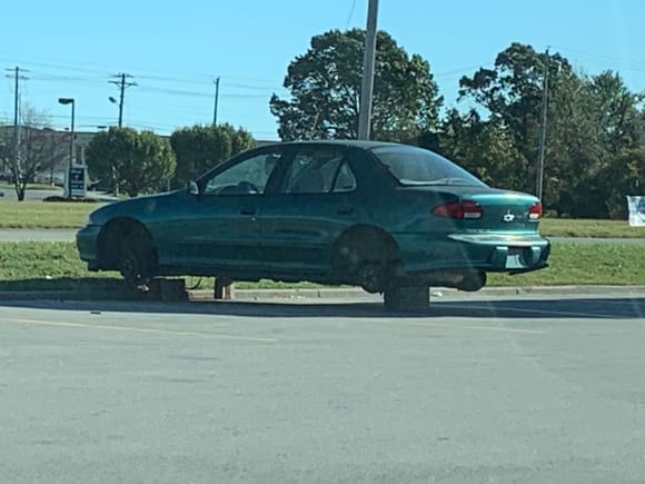 I seriously doubt this POS had nice wheels but somebody heisted them right in the Wallace World parking lot. It sucks but I’ll have to admit, I laughed pretty hard!