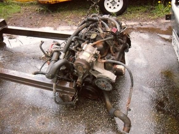 the old engine....bad injectors, cracked manifolds, rotting oil pan...who knows what else.