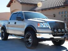 2008 Ford F150 XLT Crewcab 4X4: Modifications include 2&quot; Daystar Leveling System, 33-inch BFG All Terrain KOs mounted on 18-inch Eagle Series 197 Wheels, Aftermarket Flares, Edge Evolution Programmer, Flowmaster SS Dual Exit Exhaust, K&amp;N Cold Air Intake, Randy Ellis Light Bar with (4) PIAA Lights, Roush Grille, Chrome Sidesteps, Bedliner, Window Visors, and Full 20% Tinted Windows.