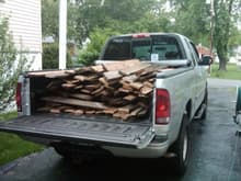 Hauling away old deck boards.