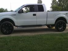 2" AS Front Level Kit with 1.5" AS AAL in the Rear.  Back sits about 1" higher than front. 33" Tires