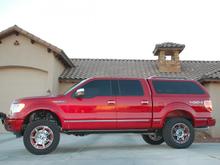 Fabtech 4-inch Suspension System with Nitto Trail Grappler MTs 295/60R20 (34-inches tall) mounted on Moto Metal 961 Wheels ( 18mm Offset, 5.71" BS) with PTM Inserts.