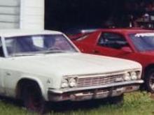 my favorite pic of my firebird next to my dad's 66 caprice coupe