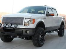 2009 Ford FX4 with Rancho suspension system, 35-inch BFG KM2 MTs, 18x9 KMC XD Series Addict machined/flat black wheels, Street Scene billet grille, Smittybilt lightbar with PIAA 540 Series Superwhite driving lights and 520 ATP Series Superwhite offroad lights, and Magnaflow SS Dual-exit exhaust system.