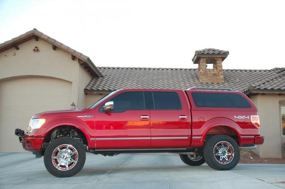 Fabtech 4-inch Suspension System with Nitto Trail Grappler MTs 295/60R20 (34-inches tall) mounted on Moto Metal 961 Wheels ( 18mm Offset, 5.71" BS) with PTM Inserts.