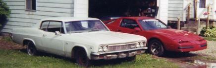 my favorite pic of my firebird next to my dad's 66 caprice coupe