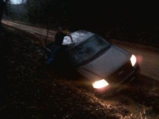 Me on the embankment sitting on the roof of my truck