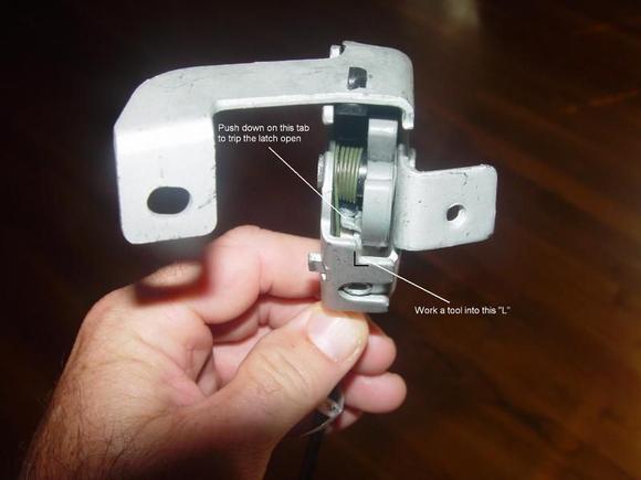 Tripping open the upper latch. (This is a driver's side latch)