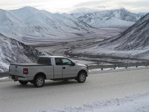 Looking down the south side of Atigun Pass.  The Dalton Hwy and Trans Alaska Pipeline below.