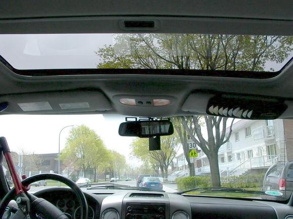 Inside the cab, front view with a view of the moonroof.