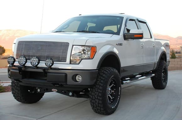 2009 Ford FX4 with Rancho suspension system, 35-inch BFG KM2 MTs, 18x9 KMC XD Series Addict machined/flat black wheels, Street Scene billet grille, Smittybilt lightbar with PIAA 540 Series Superwhite driving lights and 520 ATP Series Superwhite offroad lights, and Magnaflow SS Dual-exit exhaust system.