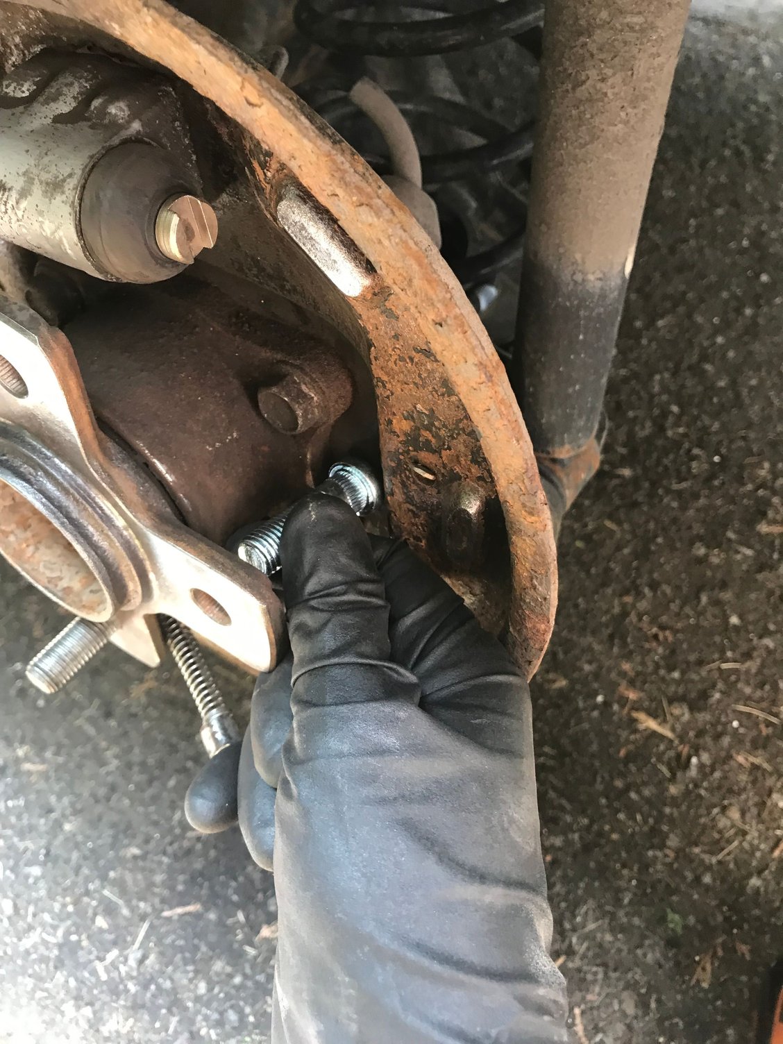 Loads of clearance to install the stud from behind. 2 good whacks from a regular hammer and out came the bad studs. No heat, no penetrating oil, nothing. I couldn’t get the “splines” to align with the old ones and it took nearly the highest setting on my impact driver to pull these through with lug nut. I wouldn’t want to attempt this with a wrench.