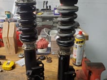 Here is the difference.  The coilover stack on the left is the new bits as they will be attached to the plate with 4 allen bolts per side.  There are six bolt holes to provide even more adjustability for the four allen bolts...