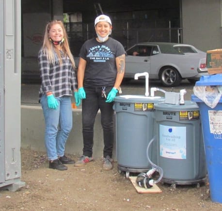 Sam Reardon and Scarlet finish installing their first mobile handwashing station in Berkeley. Photos by Melanie Curry/Streetsblog