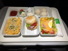 Starting from lower right: chef’s salad, classic cheeseburger, mac&cheese, ketchup, tomato basil mozzarella skewer, and ice cream.