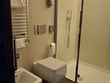 Bathroom at the milan centric. Toilet, bidet, and shower.