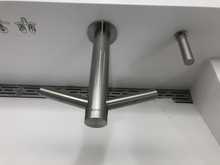 Modern faucet with built-in hand dryer.