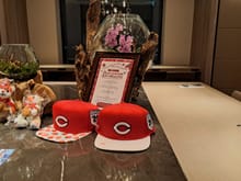 The hilton hiroshima carp hats and bears in the executive lounge just before 9pm. Places being set for breakfast.  Bought the hat and the bear