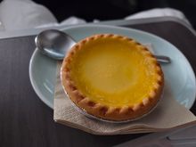 Eggtart - Delishhh.  I also wanted to get the hamburger but I was thrown off by the timing of the meals.  The in-flight screen showed that we would get our second meal toward the end of the flight but actually got it mid-way.  I asked if I could get the egg tart and hamburger and flight attendant told me that they were serving our next meal soon and hamburger would take 30 minutes to prep and heat.  Fell asleep hard after our second meal so I never ended up getting that hamburger!