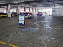 They have dedicated areas for Uber and Lyft. For me a Lyft as I get Hilton Points and is mostly cheaper than Uber
