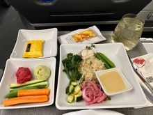 Veggies Grain Bowl.  (Preordered)  Quinoa, lentils, pickled onions, veggies, hummus, crackers.  Lemon vinaigrette.  Dark chocolate.   Tasty.   Other choices were Veggie Lasagna or Charcuterie plate. 