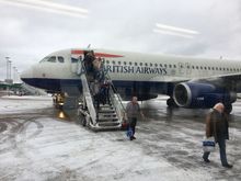 This snowy scene was GOT this Friday morning as we disembarked the 320 onto a bus. It then takes you on a short-ish ride round to some rather snowy and precarious metal steps up to a door which you then go through and round the corner to border control. Definitely 10 mins including waiting time for bus to fill up. 