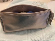 This is obviously a pencil case style bag.