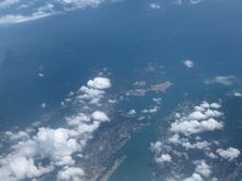 Here’s one from very far above.  Taken on a SYX-SHA flight in August 2020.   Not as nice as the OP’s photos but gives a good view of the Kowloon area from 30k feet.