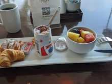This was the Tit breakfast being offered by the Sheraton Waikiki in Sept when they removed the buffet breakfast.  Pastry, yogurt and fruit plus coffee/tea/juice (plus one day, they had no yogurt)!  I understand that what they were offering before they had to close the buffet was pared back but included some hot options. 

How would you describe this breakfast. :)