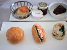 Sandwich selection, plain scone and chocolate glaze cake