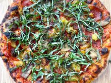 Mushroom, pepperoni, green chili, and basil pizza. 