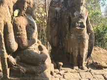 The hernit sage Agastya, other meditational Buddhas are clustered around
